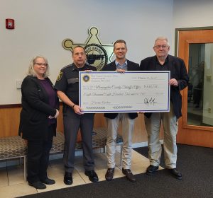 Mon Sheriff's Department awarded check from treasurer's unclaimed gun auction